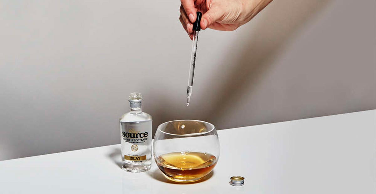 Whisky with water dropping